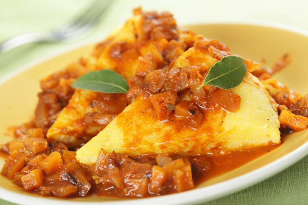 Polenta e Osei - A traditional dish made with polenta and small birds (osei)