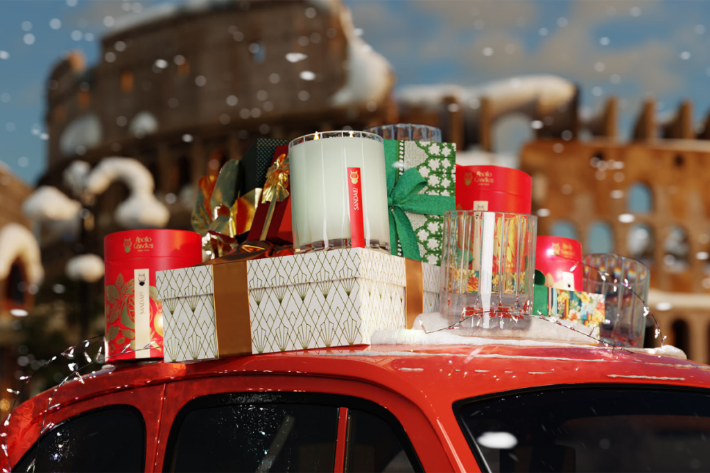 Gift boxes and candles are stacked on top of a red car, with snow falling and the Colosseum in the background.